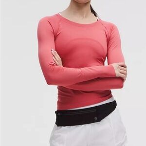 Lululemon Swiftly Tech Long Sleeve waist length with thumb holes.  Size 14